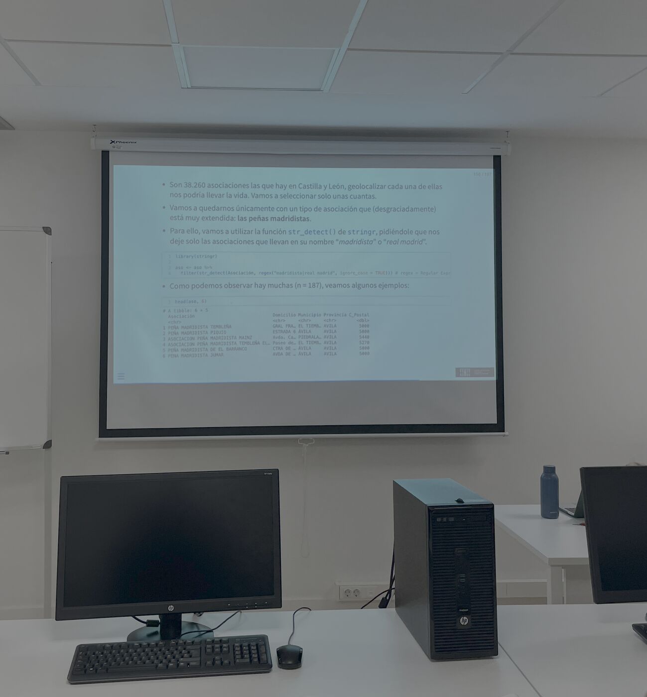 Classroom with course slides projected